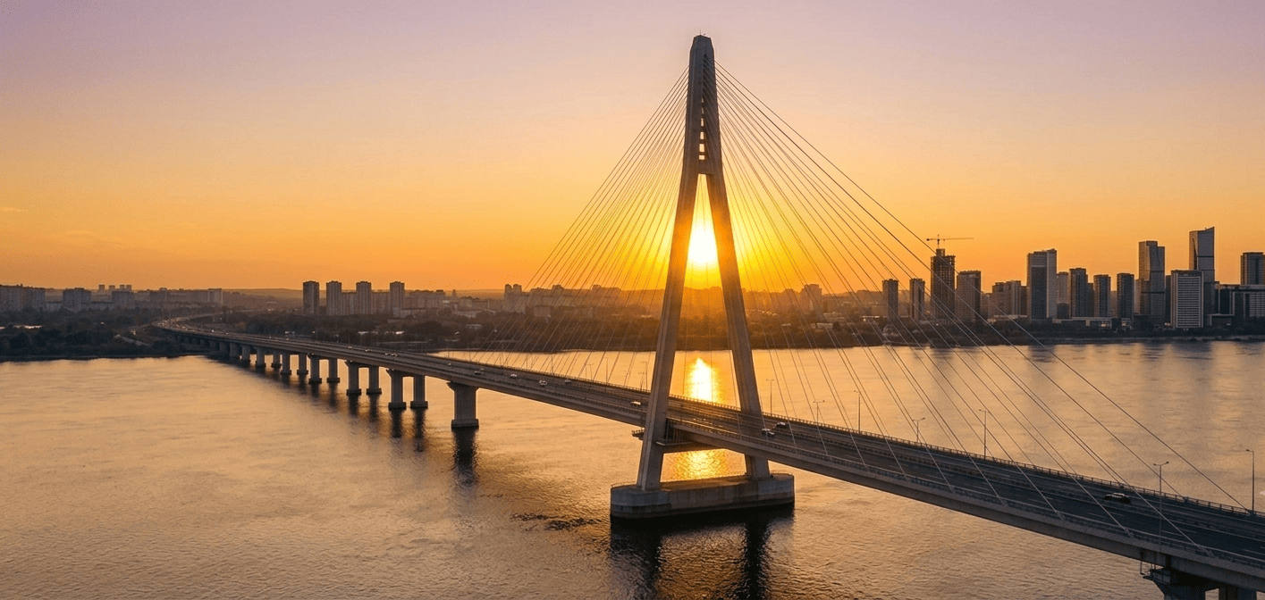 Modern suspension bridge against a warm sky, representing logistics infrastructure